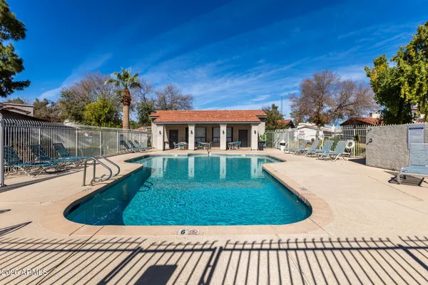 a view of a swimming pool with a patio