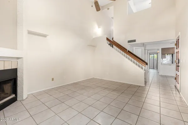 a view of an empty room and stairs