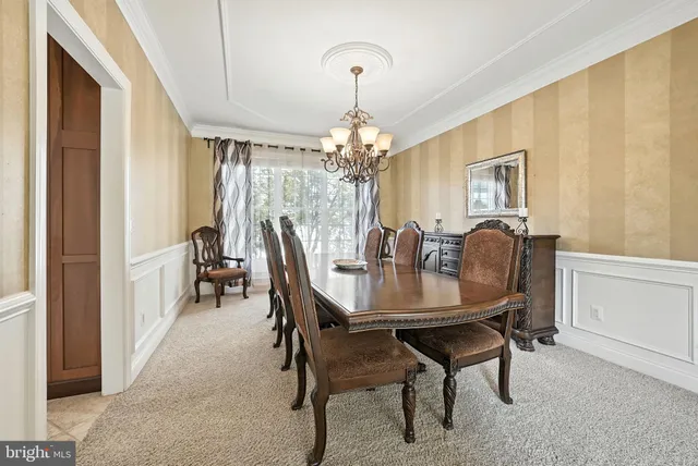 a kitchen with stainless steel appliances granite countertop sink stove top oven and cabinets