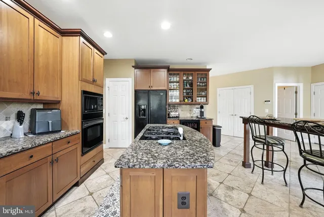 a view of a a dining room with furniture window and wooden floor