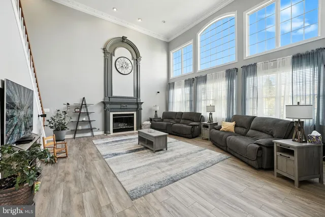 a bedroom with a bed a couch and dresser