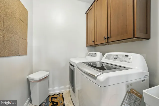 a bedroom with a bed window and a mirror