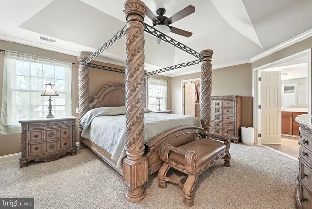a bathroom with a granite countertop sink mirror and cabinets