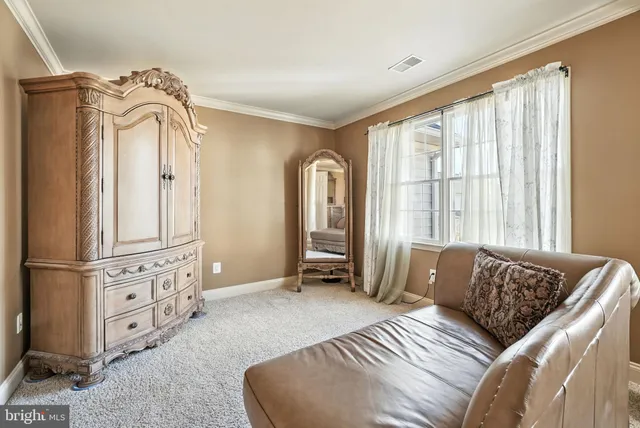 a bedroom with a bed and a flat tv screen