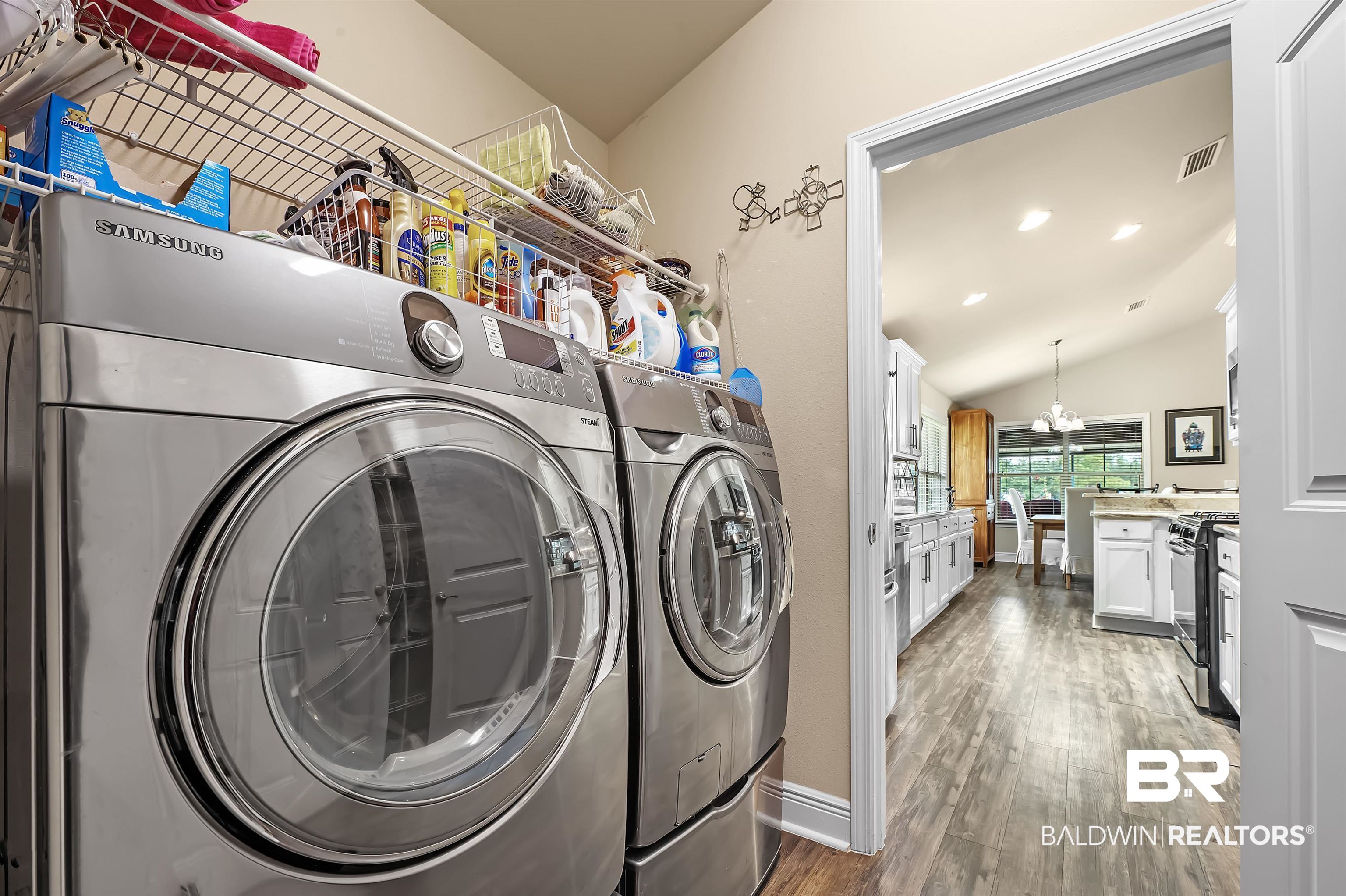 8896 Allay Lane Foley, AL 36535 - Photo 34 of 57 Laundry room featuring hardwood / wood-style flooring and washing machine and clothes dryer