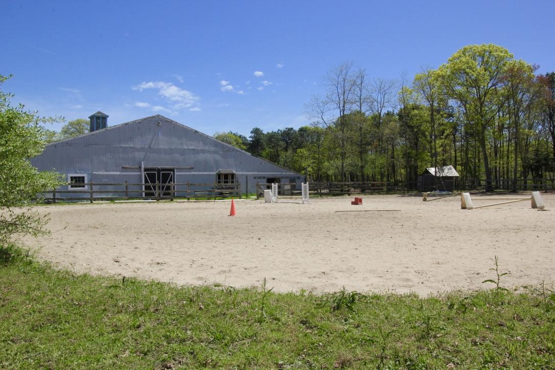 809 Sandwich Road East Falmouth, MA 02536 - Photo 5 of 20 a front view of a house with a yard