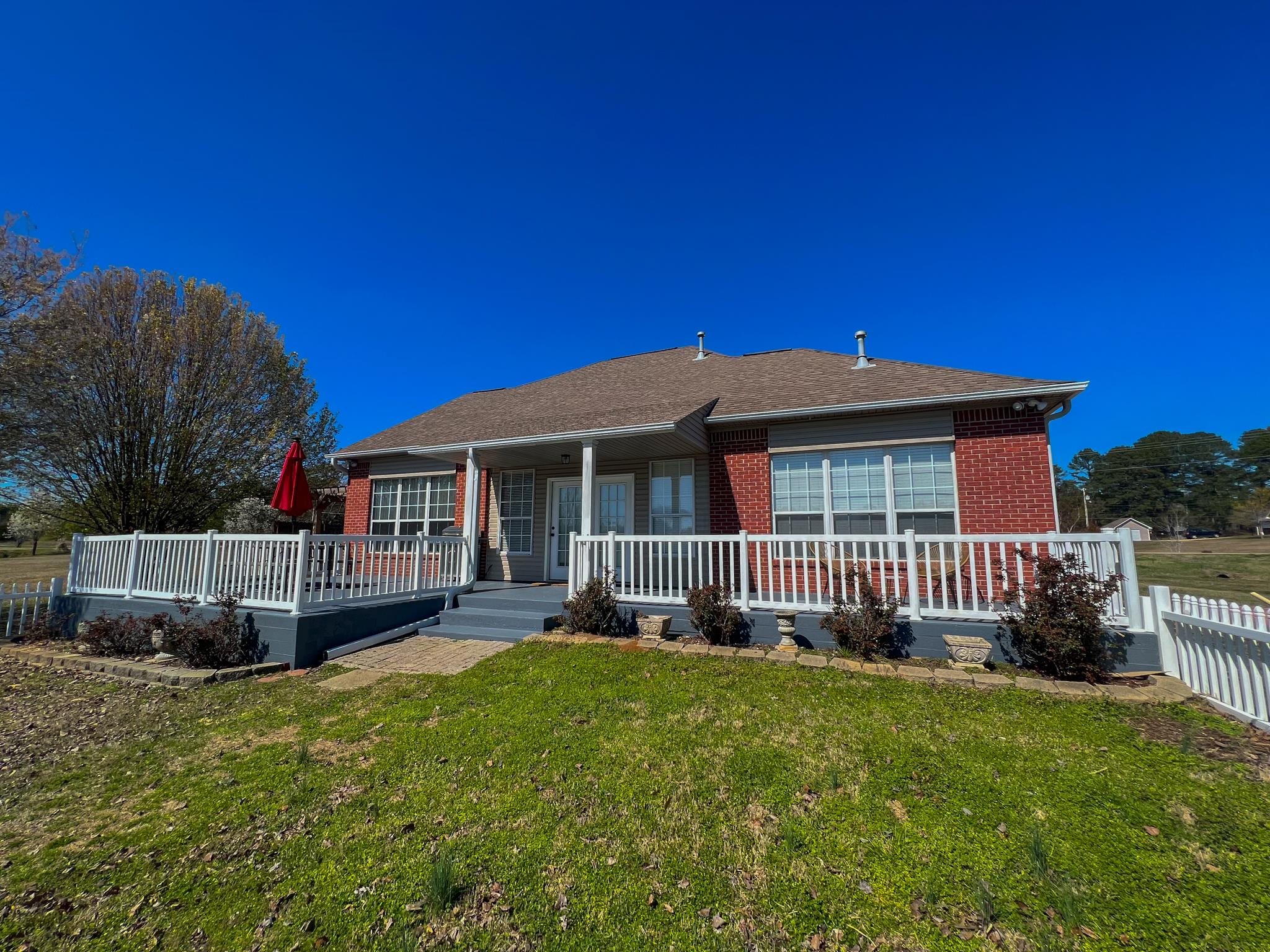 96 County Road 178 Iuka, MS 38852 - Photo 17 of 21 a front view of a house with a garden