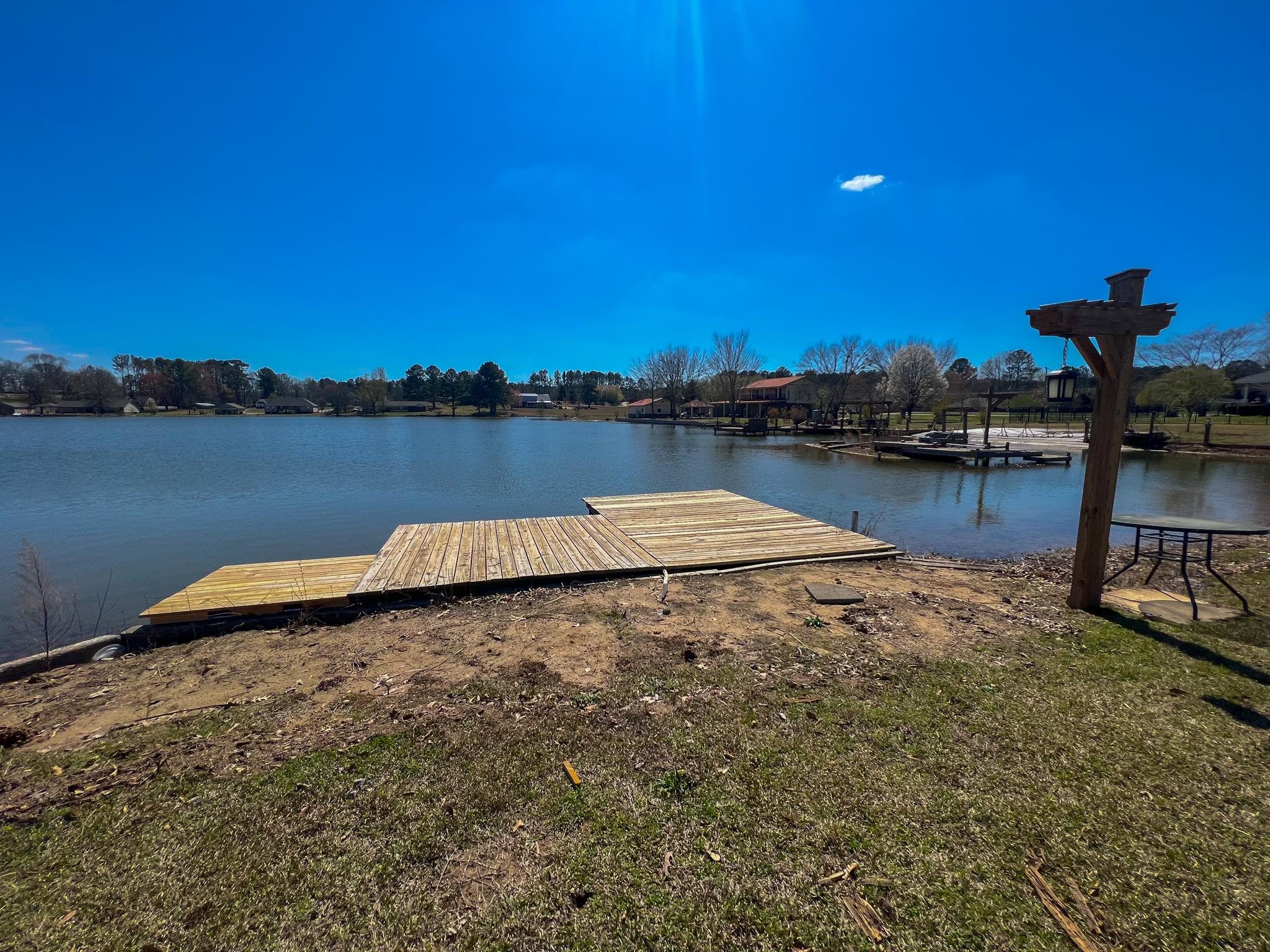 96 County Road 178 Iuka, MS 38852 - Photo 19 of 21 a view of a lake with houses in the back