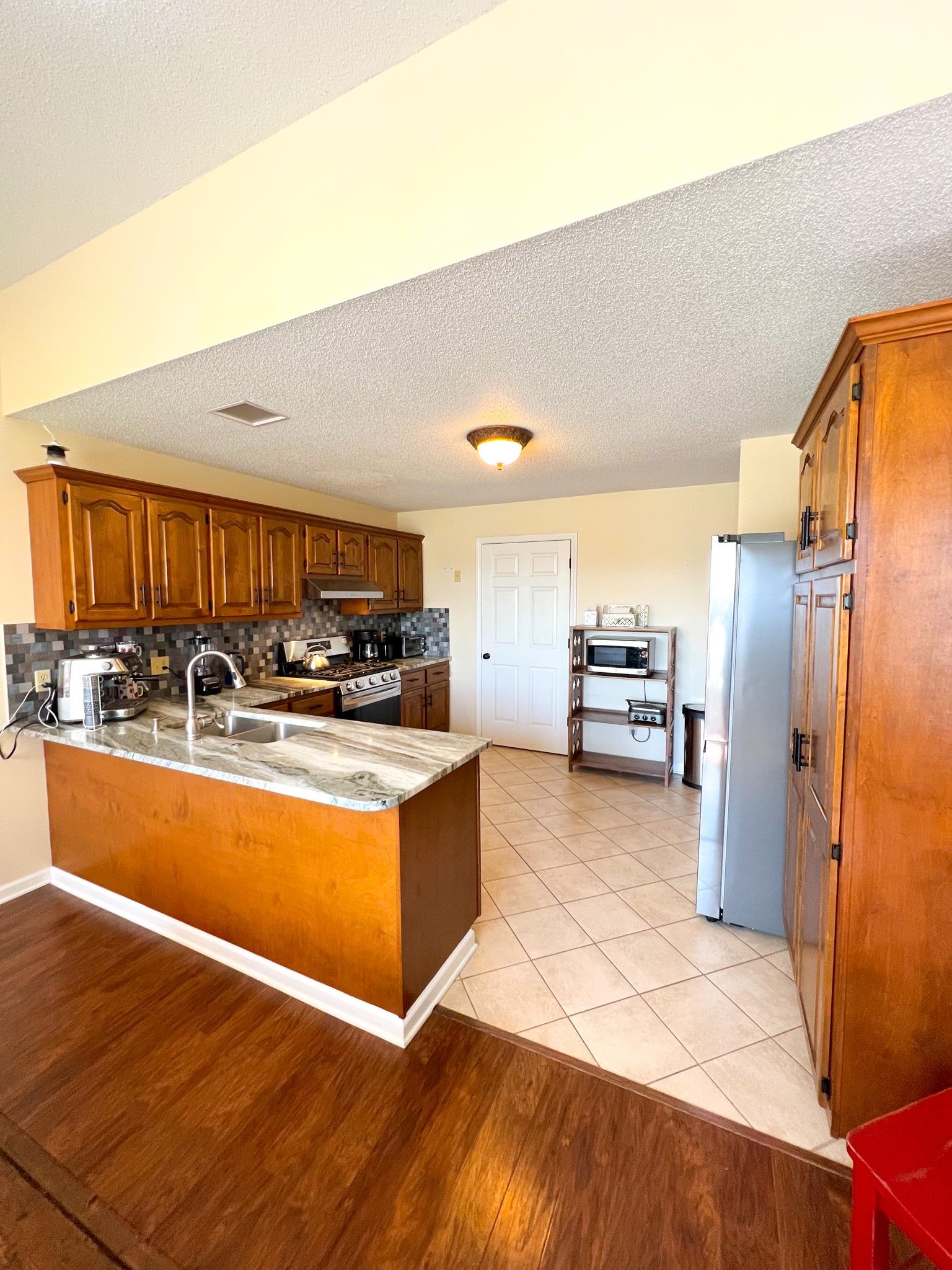 96 County Road 178 Iuka, MS 38852 - Photo 6 of 21 a kitchen with stainless steel appliances granite countertop a refrigerator and a stove