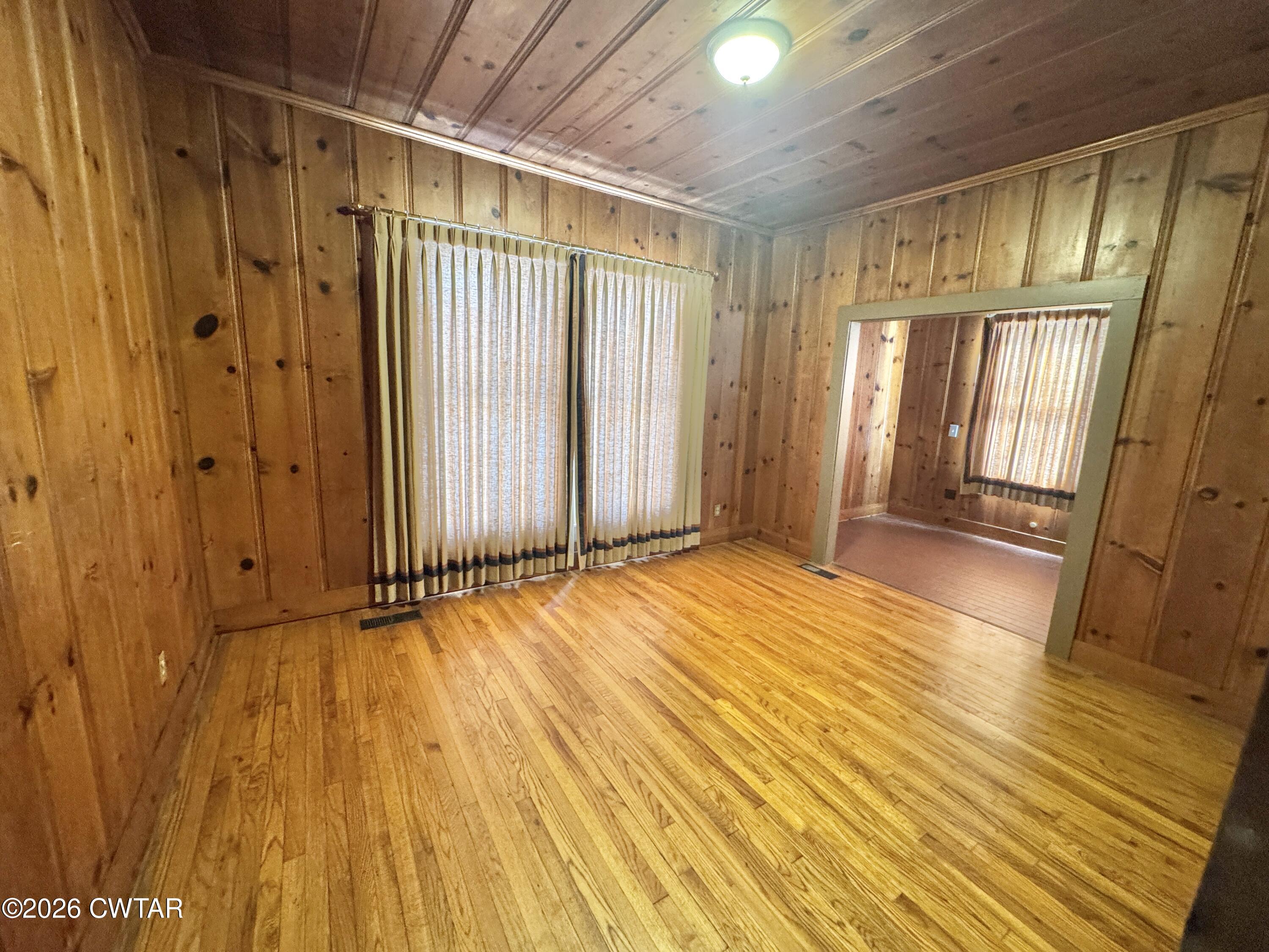243 Eastend Street Ripley, TN 38063 - Photo 9 of 16 a view of empty room with wooden floor and fan