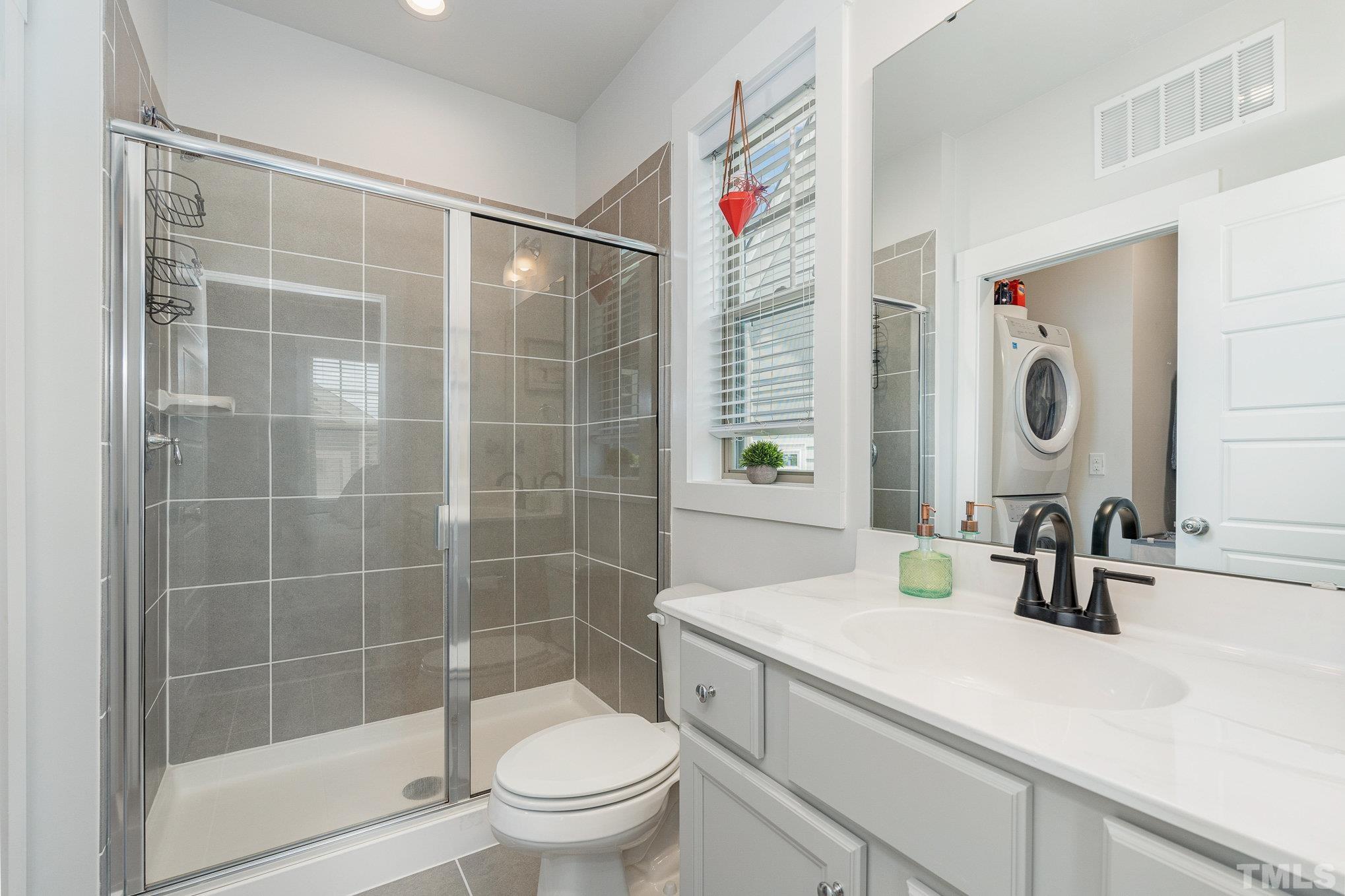 282 Cottage Way, Unit 48 Pittsboro, NC 27312 - Photo 12 of 16 a bathroom with a sink and a mirror