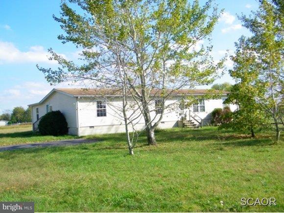 3922 Fox Hunters Road, Unit 1 Harrington, DE 19952 - Photo 1 of 16 a view of a house with a backyard
