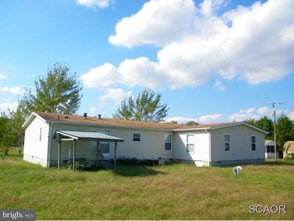 3922 Fox Hunters Road, Unit 1 Harrington, DE 19952 - Photo 2 of 16 a view of a house with a yard