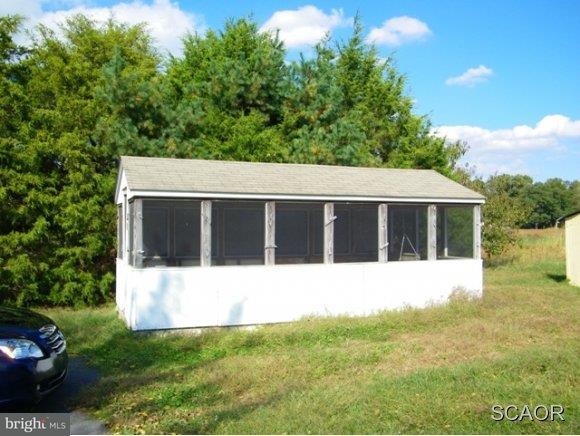 3922 Fox Hunters Road, Unit 1 Harrington, DE 19952 - Photo 15 of 16 a view of house with backyard space and balcony