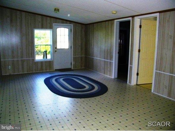 3922 Fox Hunters Road, Unit 1 Harrington, DE 19952 - Photo 6 of 16 a living room with furniture and a rug