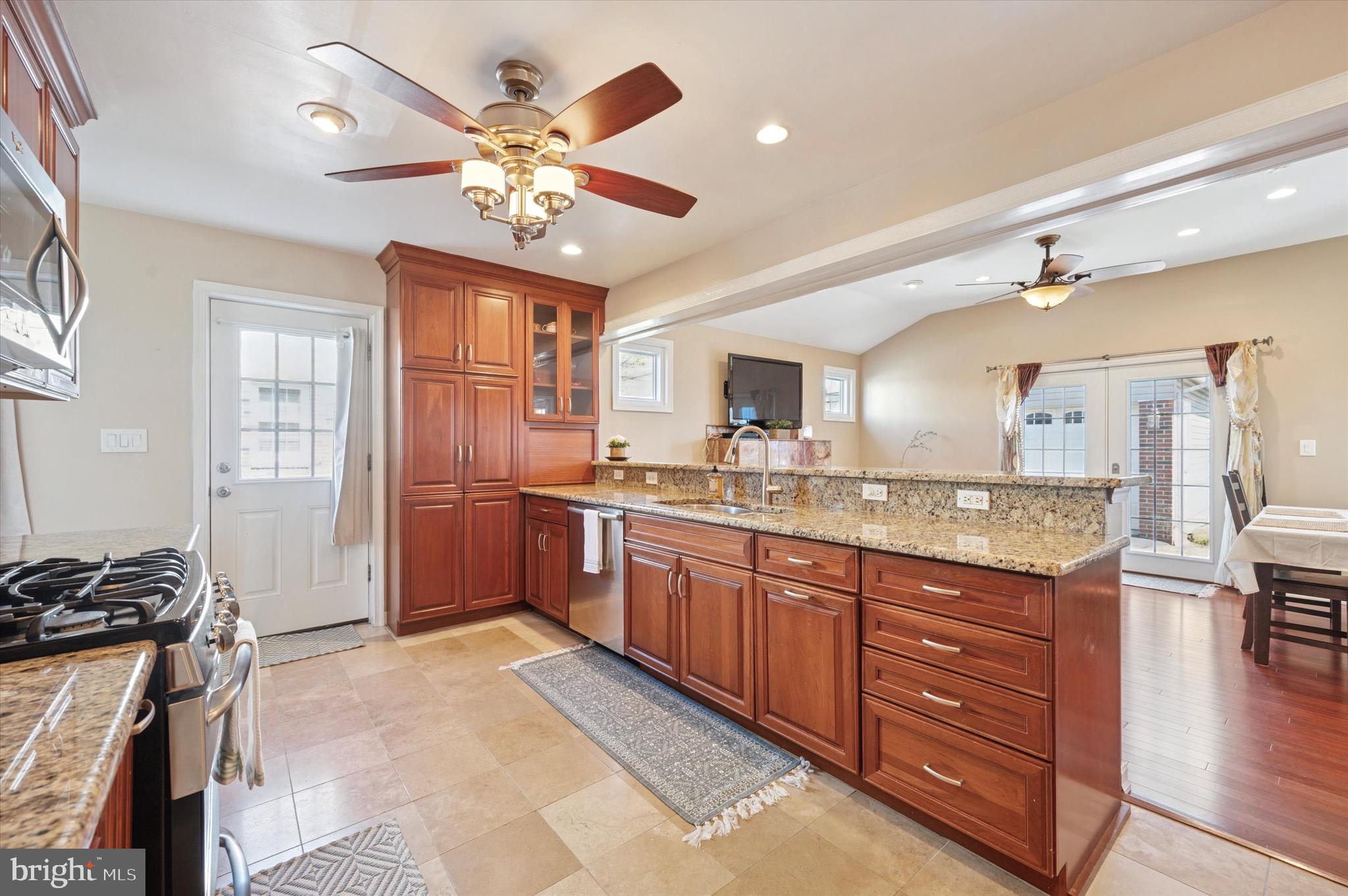 507 Bonsall Road Ridley Park, PA 19078 - Photo 8 of 35 a kitchen with a stove a sink and a refrigerator