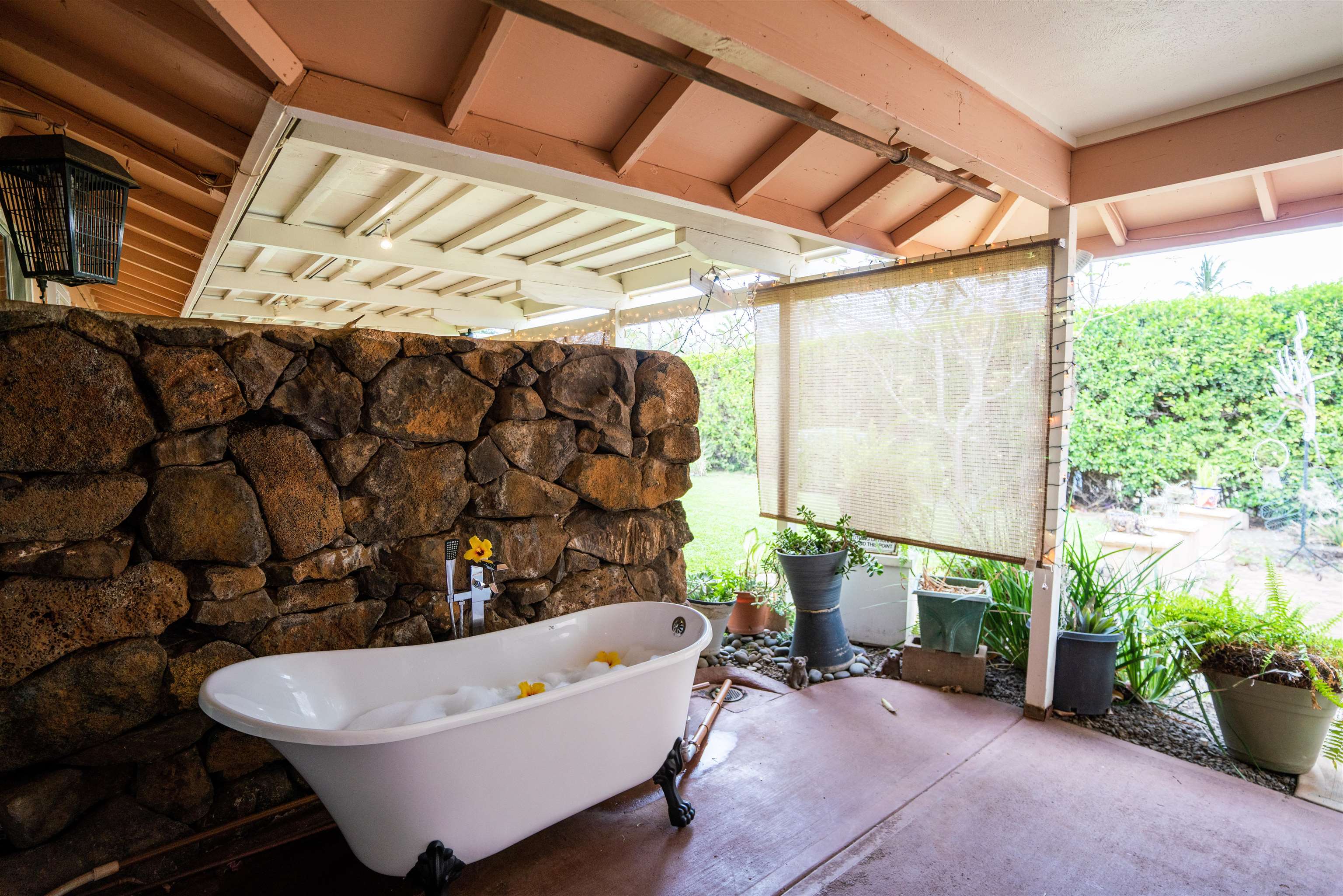 107 Mehani Place Kihei, HI 96753 - Photo 22 of 30 a living room with patio furniture and a potted plant