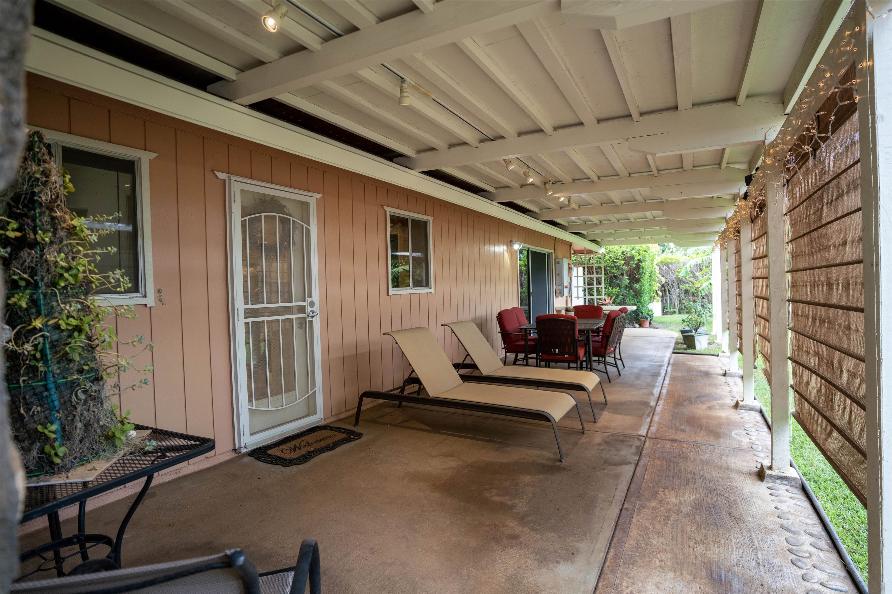 107 Mehani Place Kihei, HI 96753 - Photo 24 of 30 a view of a patio with table and chairs and potted plants