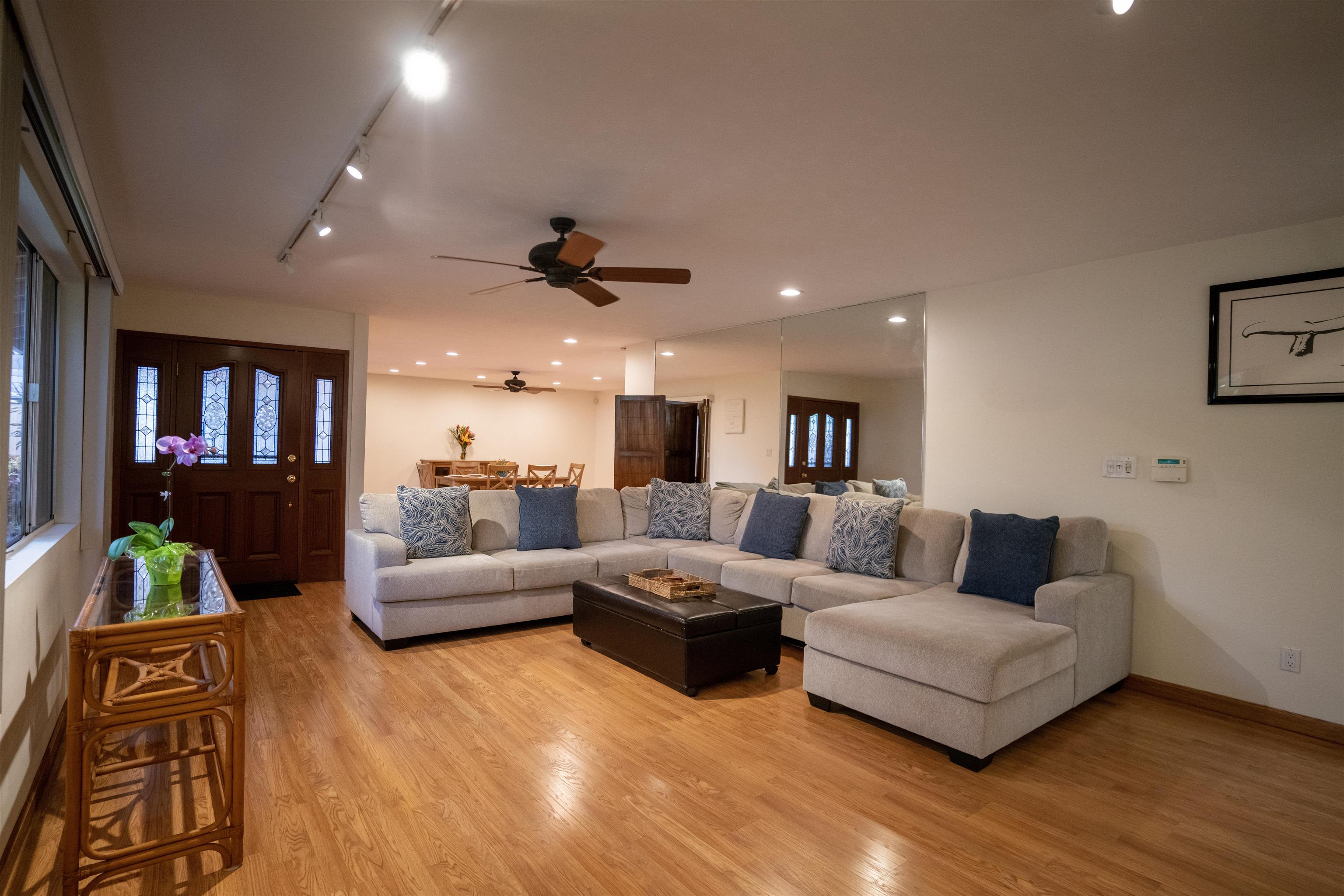 107 Mehani Place Kihei, HI 96753 - Photo 4 of 30 a living room with furniture and a flat screen tv