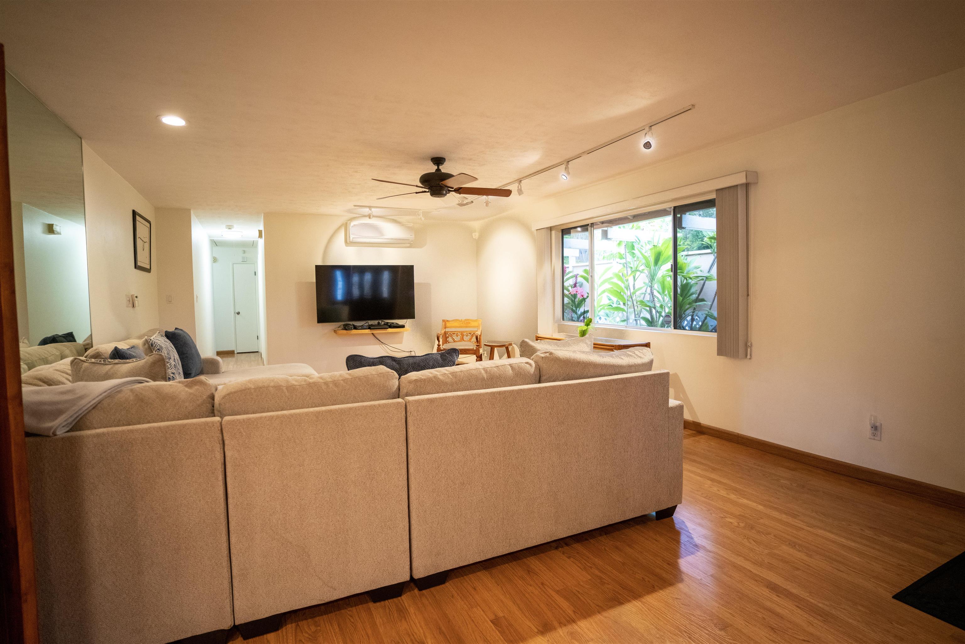 107 Mehani Place Kihei, HI 96753 - Photo 5 of 30 a living room with furniture and a flat screen tv
