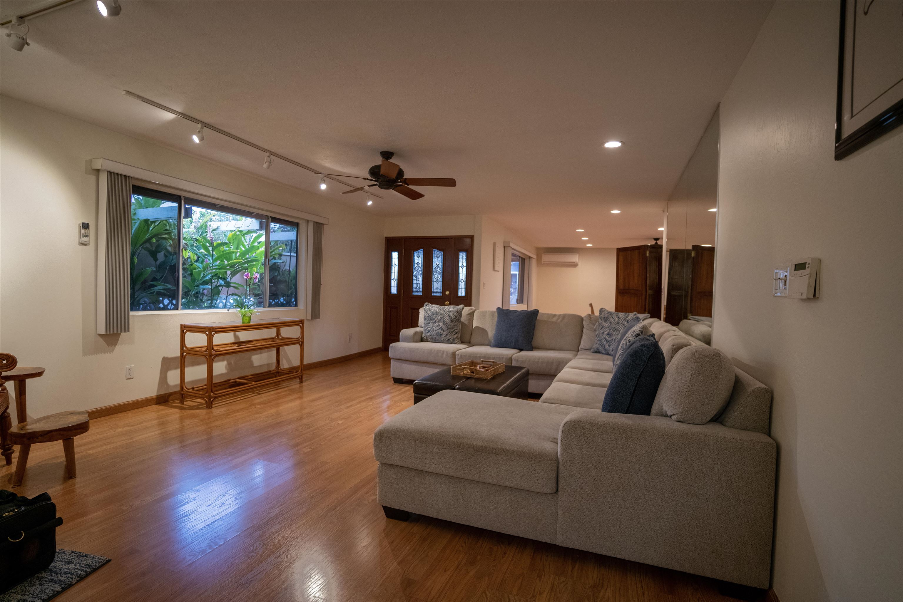 107 Mehani Place Kihei, HI 96753 - Photo 7 of 30 a living room with furniture and a large window