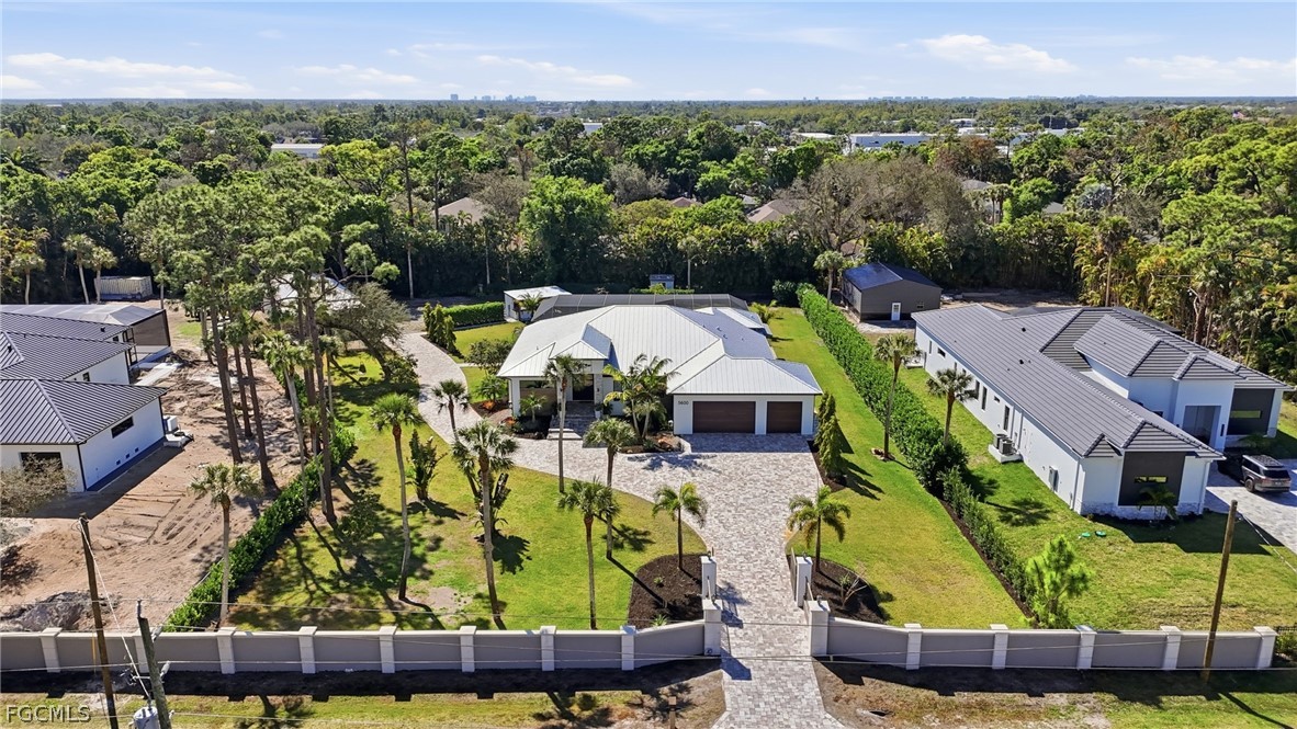 5600 Briarcliff Road Fort Myers, FL 33912 - Photo 3 of 50 an aerial view of multiple houses with a yard
