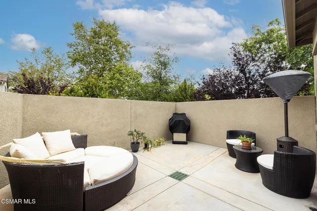 a terrace of a house with outdoor seating
