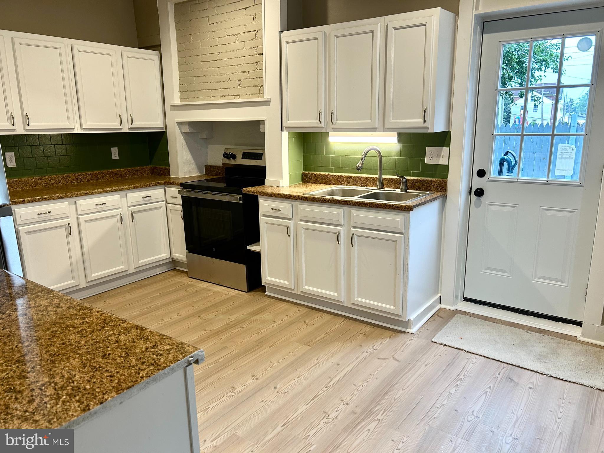 112 Locust Street Hanover, PA 17331 - Photo 16 of 45 NEW FLOORING WITH NEW BACK DOOR