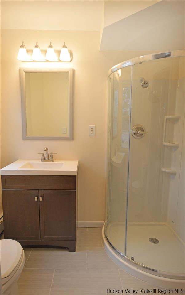 47 Roxanne Boulevard Highland, NY 12528 - Photo 12 of 24 a bathroom with a sink vanity and a mirror