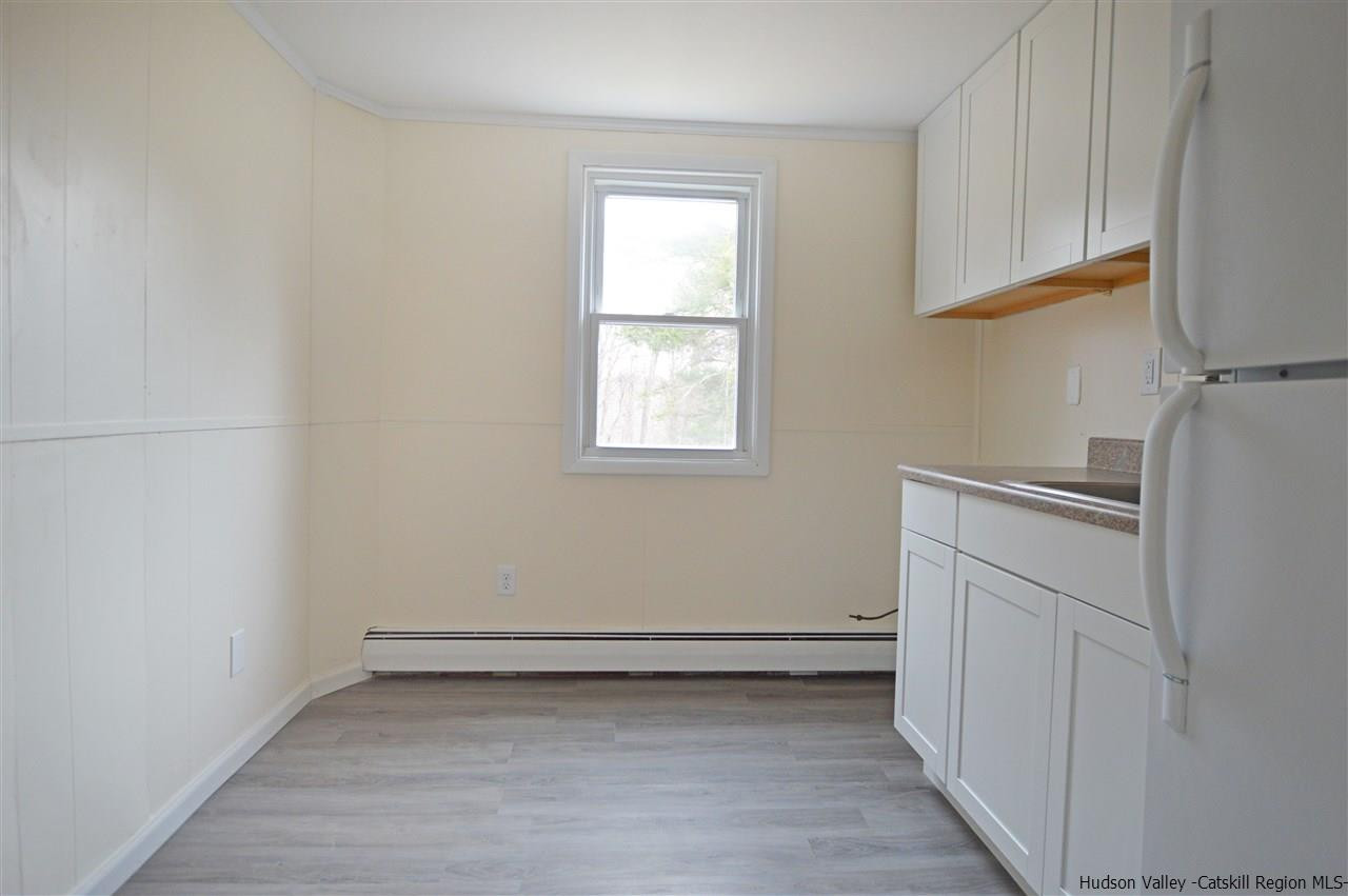 47 Roxanne Boulevard Highland, NY 12528 - Photo 17 of 24 a view of a kitchen with dishwasher and a refrigerator