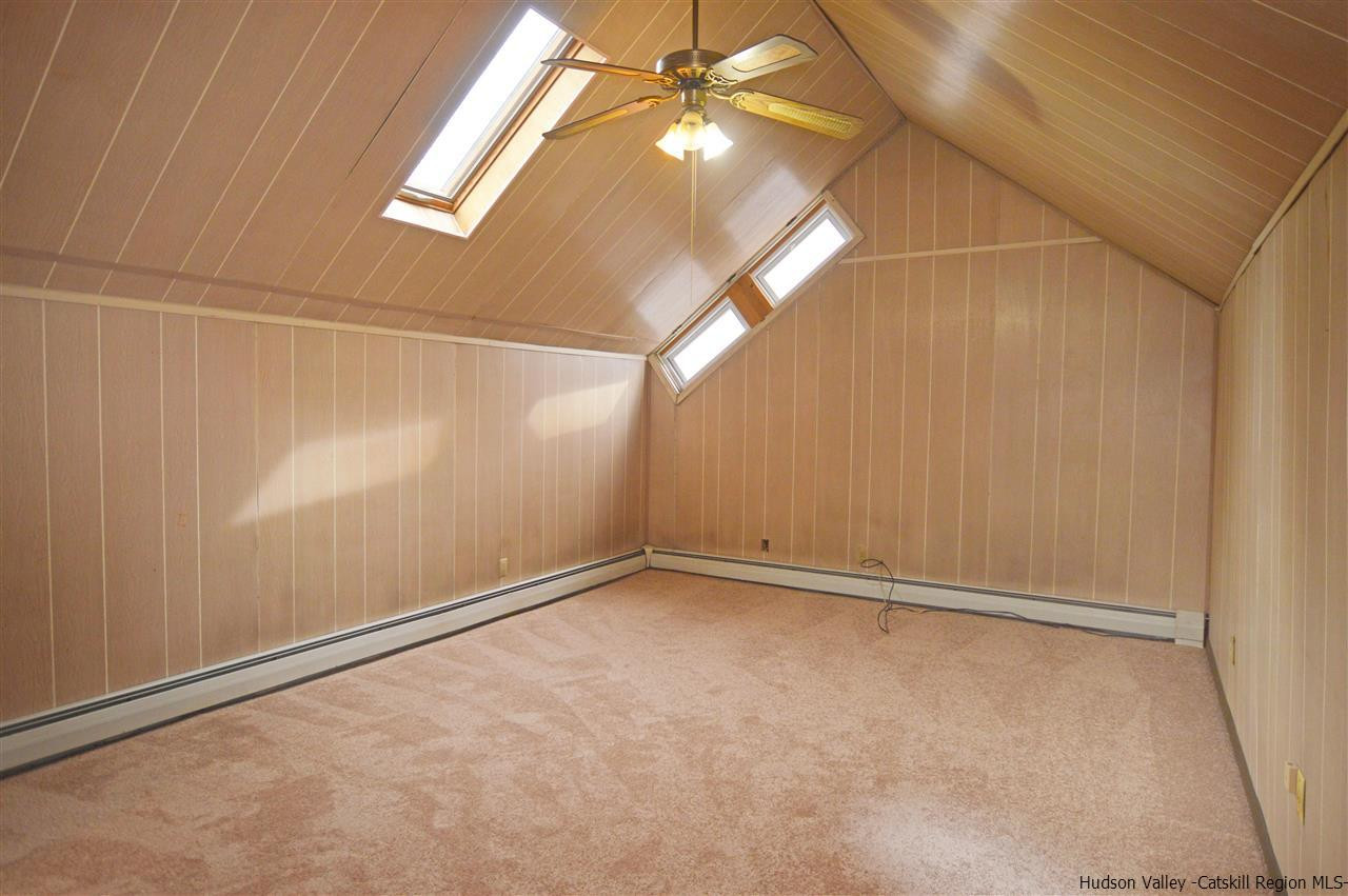 47 Roxanne Boulevard Highland, NY 12528 - Photo 19 of 24 an empty room with a windows and chandelier fan