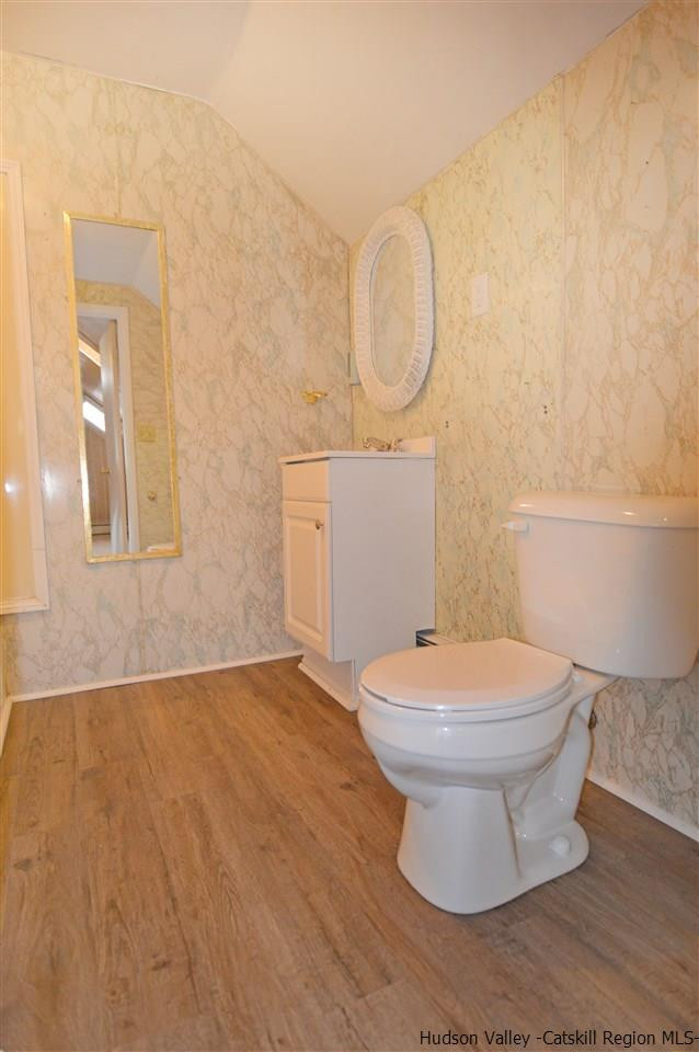 47 Roxanne Boulevard Highland, NY 12528 - Photo 20 of 24 a bathroom with a toilet sink and a mirror
