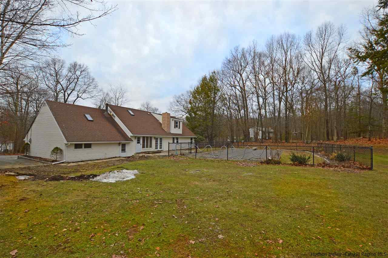 47 Roxanne Boulevard Highland, NY 12528 - Photo 22 of 24 a view of a house with a big yard and large trees