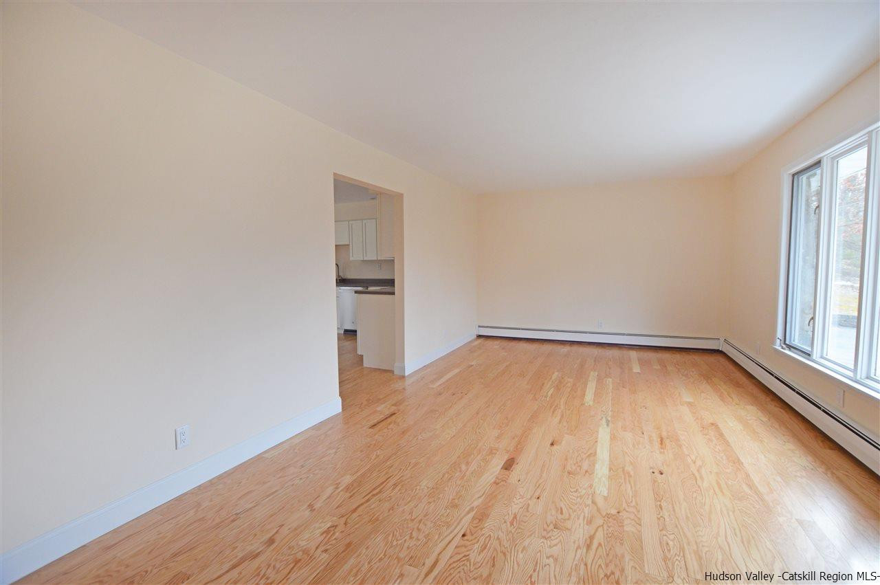47 Roxanne Boulevard Highland, NY 12528 - Photo 8 of 24 wooden floor in an empty room with a window