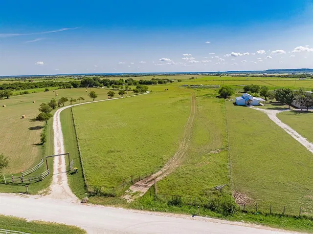 a view of an ocean beach and a yard