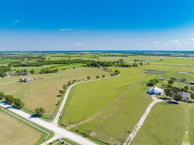 a view of a swimming pool and an outdoor seating