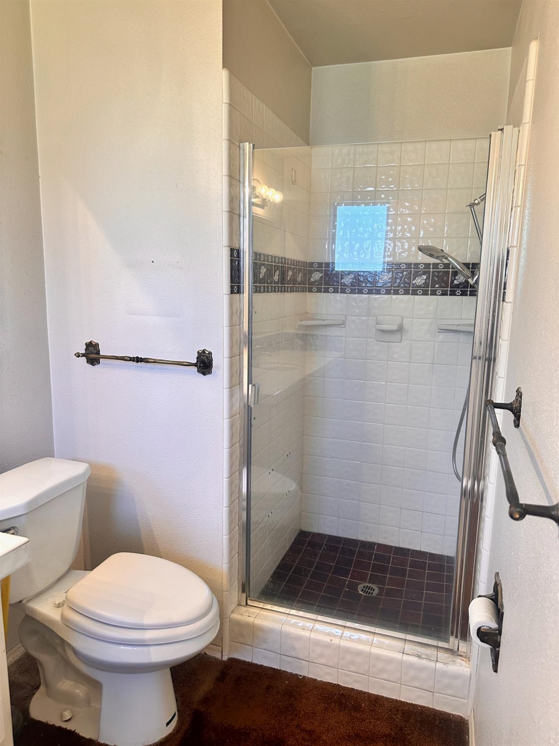 3207 Terry Way Carmichael, CA 95608 - Photo 26 of 36 a bathroom with a granite countertop shower a toilet and a sink