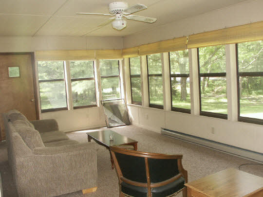 3398 North River Road Oregon, IL 61061 - Photo 4 of 11 a living room with a large window and table