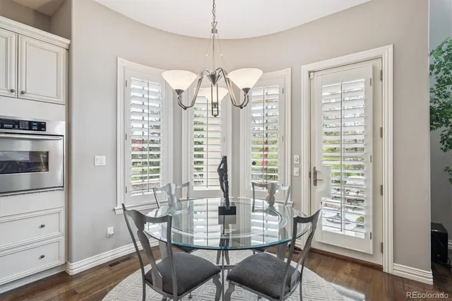a view of a dining room with furniture and window