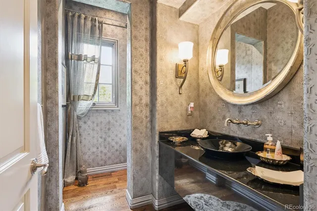 a bathroom with a toilet and a mirror