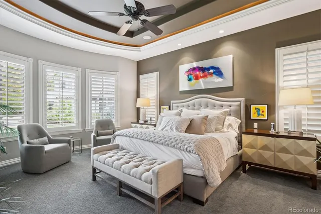 a bedroom with a bed couch and window