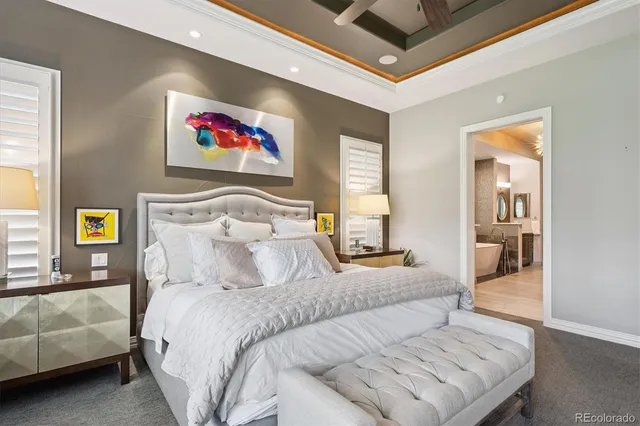 a bedroom with a bed and glass windows