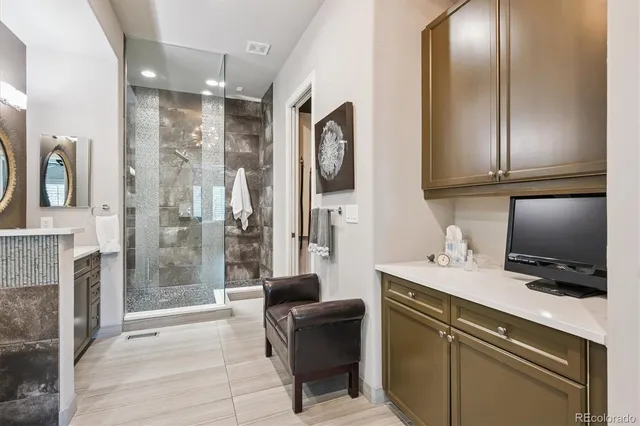 a kitchen with a refrigerator and a sink