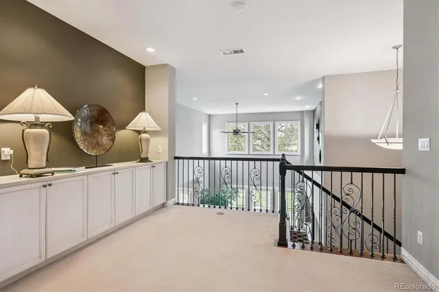 a view of a hallway to dining room with wooden floor