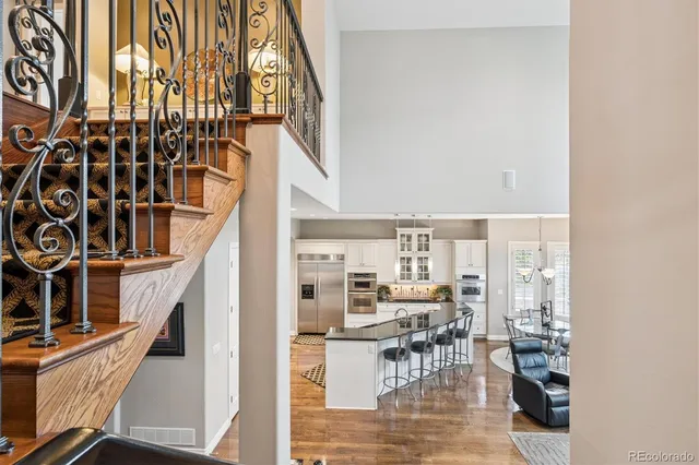 a view of a living room with a table and chairs