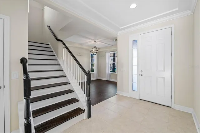 a view of entryway with wooden floor and stairs