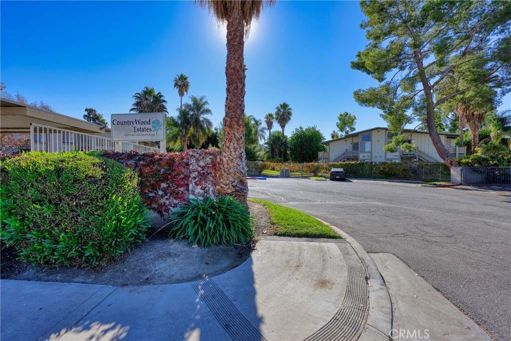 1800 East Old Ranch Road, Unit 148 Colton, CA 92324 - Photo 13 of 16 a view of a street with a building in the background