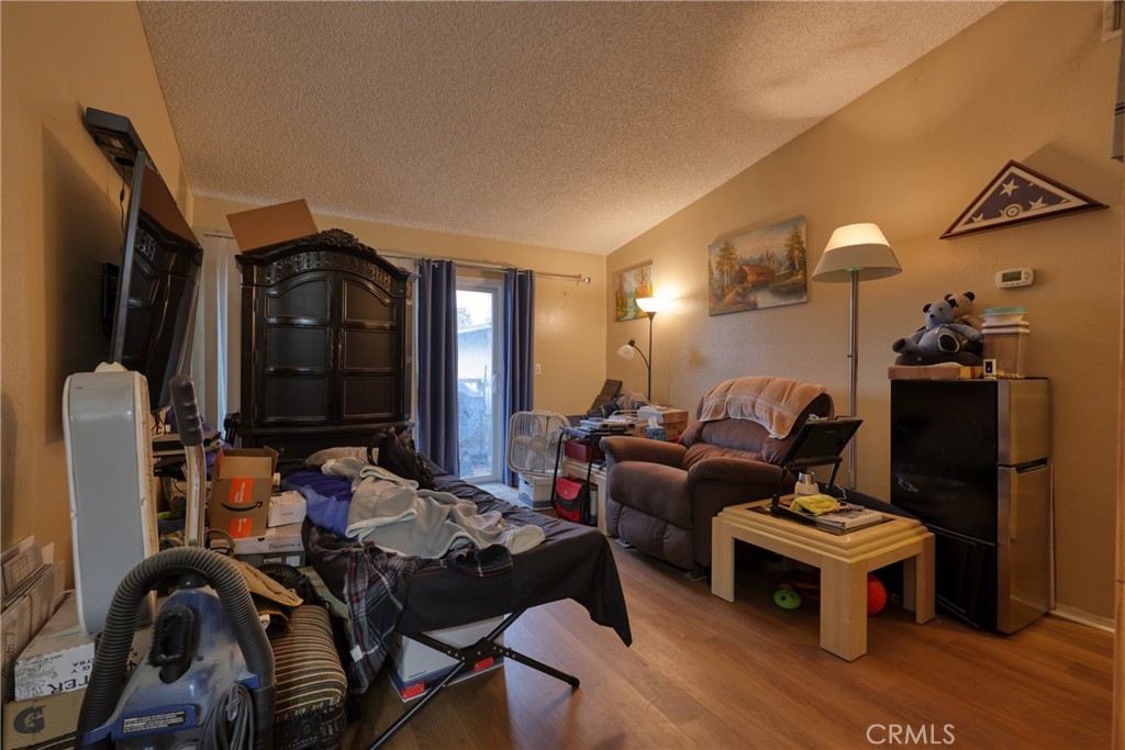 1800 East Old Ranch Road, Unit 148 Colton, CA 92324 - Photo 16 of 23 a living room with furniture and a mirror