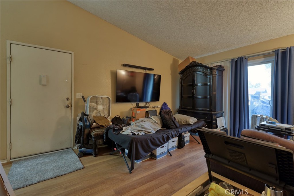1800 East Old Ranch Road, Unit 148 Colton, CA 92324 - Photo 17 of 23 a living room with furniture and a flat screen tv