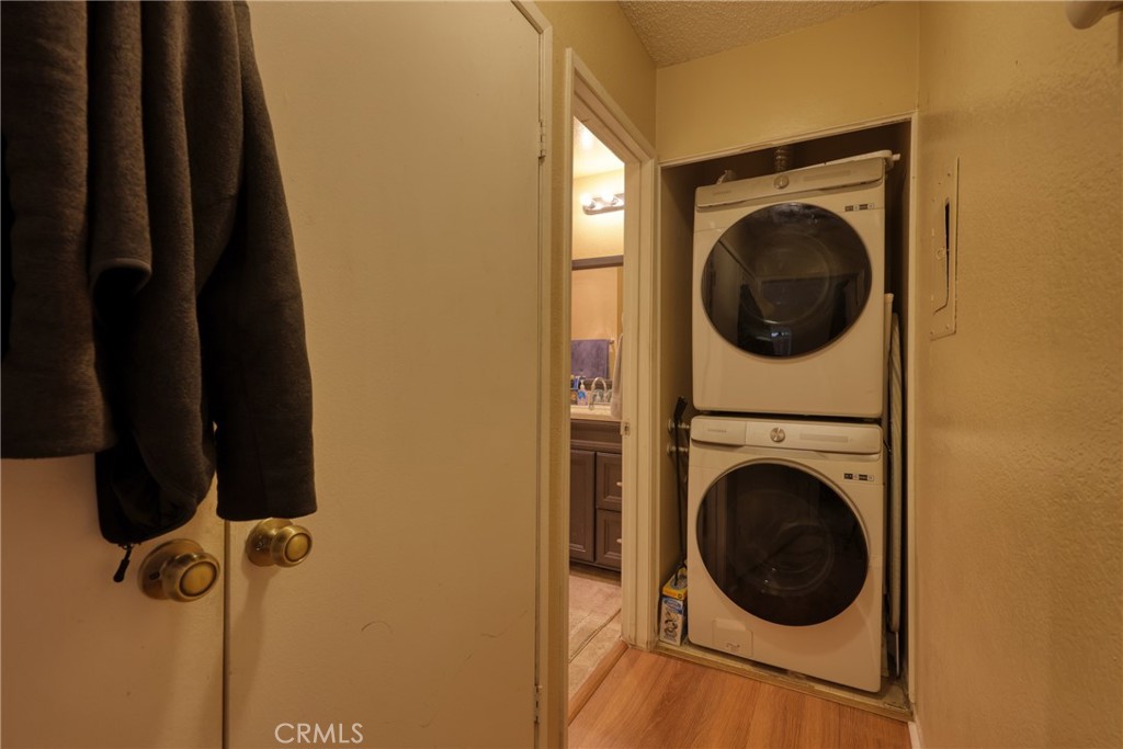 1800 East Old Ranch Road, Unit 148 Colton, CA 92324 - Photo 23 of 23 a view of a hallway with washer and dryer